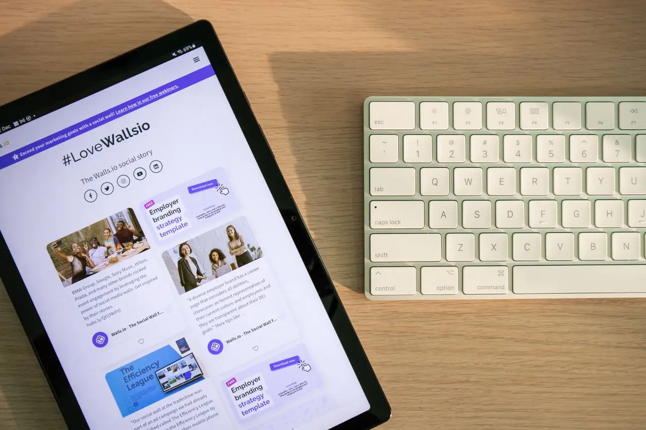 Crafting Captivating Headlines: Your awesome post title goes here Tablet displaying social media on desk with keyboard, highlighting connectivity and technology.